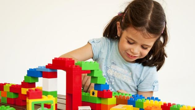 kid playing with blocks