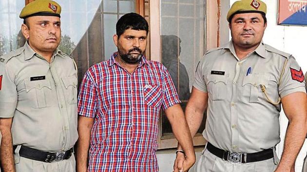Accused Rakesh Mokhriya in police custody in Rohtak on Tuesday. (Manoj Dhaka/HT) Accused Rakesh Mokhriya in police custody in Rohtak on Tuesday. (Manoj Dhaka/HT)