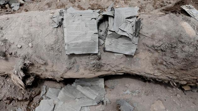 In one home, a Bible unbound sits with its pages singed. Outside, dead cattle and a bass drum lie abandoned. In the kitchen, food in pots ready to be served. At least 110 people have died and close to 200 are thought buried under the rubble in San Miguel Los Lotes on the fertile lower slopes of the volcano. (Carlos Jasso / REUTERS)
