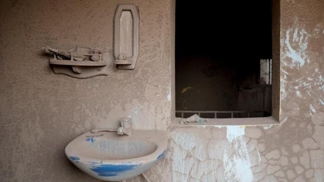 A bathroom covered in ash is seen inside a house affected by the eruption. As the burning volcanic matter rushed closer, some escaped on foot, others by car. “I took out the pickup truck and escaped with a lot of neighbours when we saw the smoke,” said Alejandro Velasquez, 46, a farmer. (Carlos Jasso / REUTERS)