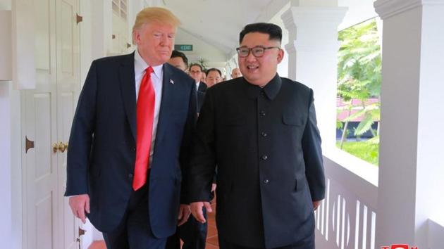 US President Donald Trump walks with North Korean leader Kim Jong Un at the Capella Hotel on Sentosa island in Singapore in this picture released on June 12, 2018 by North Korea's Korean Central News Agency.(Reuters Photo)