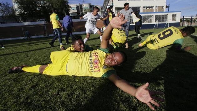 The El Empalme team, celebrates victory over Fuerzas Armadas and classifying to the next round. 23-year-old Edin Carrion had come from the Amazon to play goalkeeper for Guerreros. He lost part of his left arm four years ago after suffering an electric shock. “I have to bandage up what remains to comply with the rules,” he said. “But when you’re passionate about soccer you’ll do whatever it takes.” (Dolores Ochoa / AP) The El Empalme team, celebrates victory over Fuerzas Armadas and classifying to the next round. 23-year-old Edin Carrion had come from the Amazon to play goalkeeper for Guerreros. He lost part of his left arm four years ago after suffering an electric shock. “I have to bandage up what remains to comply with the rules,” he said. “But when you’re passionate about soccer you’ll do whatever it takes.” (Dolores Ochoa / AP)