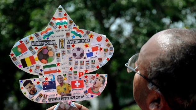 Kite-maker Jagmohan Kanojia shows a kite with photos of football players and teams participating in FIFA World Cup 2018 in Amritsar. (PTI) Kite-maker Jagmohan Kanojia shows a kite with photos of football players and teams participating in FIFA World Cup 2018 in Amritsar. (PTI)