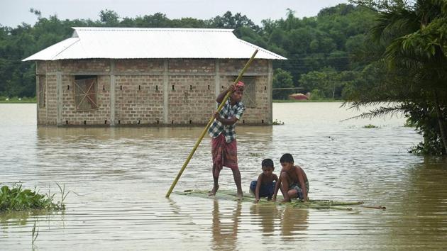 Villagers cross a flooded area on a bamboo raft at a village in Dharmanagar in Tripura. (AFP) Villagers cross a flooded area on a bamboo raft at a village in Dharmanagar in Tripura. (AFP)