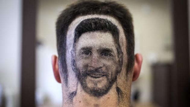 A football fan sports a hair tattoo showing the portrait of Argentinian star Lionel Messi at a hair salon in Novi Sad, Serbia. (AFP) A football fan sports a hair tattoo showing the portrait of Argentinian star Lionel Messi at a hair salon in Novi Sad, Serbia. (AFP)