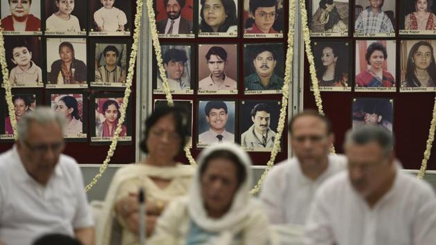 Like every year since, families of the victims of the tragedy assembled at Smriti Upavan in Green Park to pay homage to the lives lost in the blaze. Photographs of the victims lined the walls as family members still seeking justice grieved their loss. (Sanchit Khanna / HT Photo) 