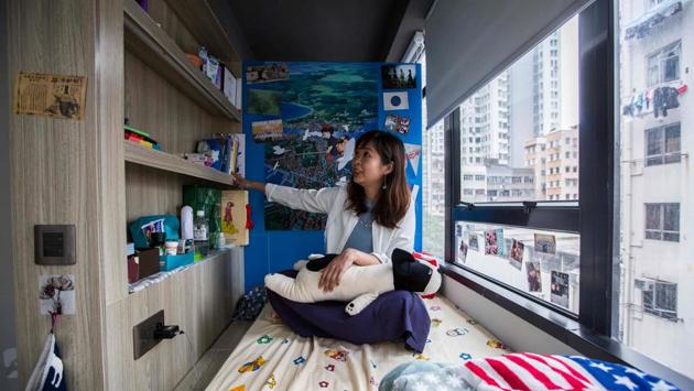 Ng shares a unit with seven other women. Her room can fit a single bed and a desk. She pays $5,600 per month, which allows her to support her parents financially and pay her sister’s tuition fees for a master’s degree -- a common practice for young adults who are working. Ng adds she feels less cramped than when she lived at home. (Isaac Lawrence / AFP)