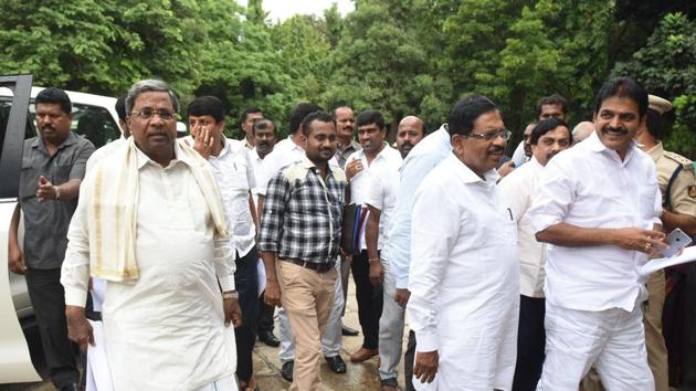 Former Karnataka CM Siddaramaiah (left) arrives for the first co-ordination committee meeting in Bengaluru on Thursday.(Arijit Sen/HT Photo) Former Karnataka CM Siddaramaiah (left) arrives for the first co-ordination committee meeting in Bengaluru on Thursday.(Arijit Sen/HT Photo)