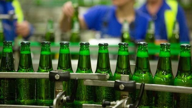 Green bottles of Carlsberg beer move along the production line at the Baltika Breweries LLC plant, operated by Carlsberg A/S, in Saint Petersburg, Russia. (Andrey Rudakov/Bloomberg)
