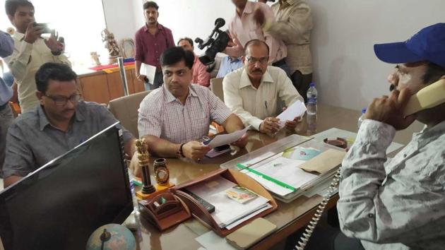 Sports council officials take possession of the ground and pavilions from RCA, at SMS stadium in Jaipur on Thursday.(HT Photo)