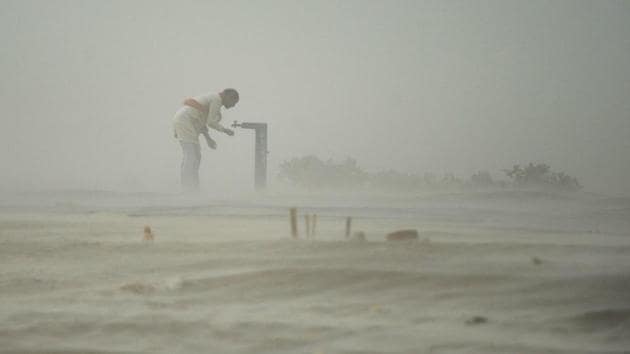 A devotee drinks from a tap during a dust storm at the Sangam, the confluence of the rivers Ganga, Yamuna and Saraswati in Allahabad. Dust storms hit various parts of Uttar Pradesh, leaving seven persons dead and 21 injured, an official spokesman said. Taking note, chief minister Yogi Adityanath has ordered district magistrates concerned to ensure proper treatment for the injured. (Sanjay Kanojia / AFP File) A devotee drinks from a tap during a dust storm at the Sangam, the confluence of the rivers Ganga, Yamuna and Saraswati in Allahabad. Dust storms hit various parts of Uttar Pradesh, leaving seven persons dead and 21 injured, an official spokesman said. Taking note, chief minister Yogi Adityanath has ordered district magistrates concerned to ensure proper treatment for the injured. (Sanjay Kanojia / AFP File)
