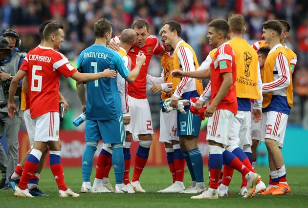 Russia players celebrate with team mates after the match. (REUTERS)