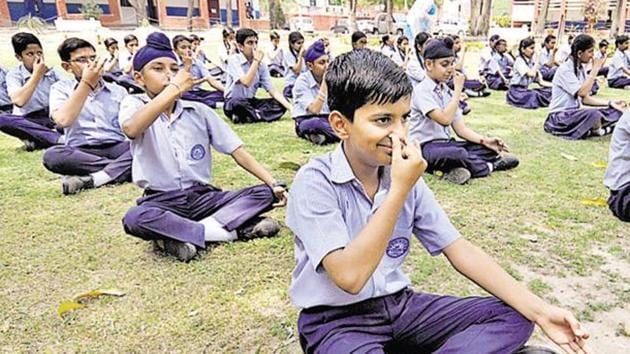 State education minister Vinod Tawde has directed officials to ensure students perform different asanas on the 21st of every month. (HT File Photo) State education minister Vinod Tawde has directed officials to ensure students perform different asanas on the 21st of every month. (HT File Photo)