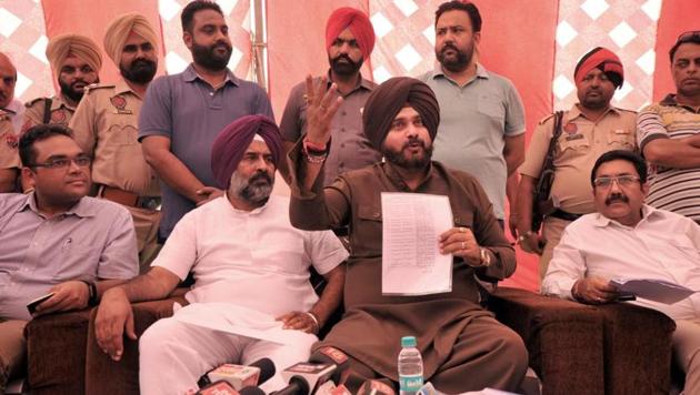 Local bodies minister Navjot Singh Sidhu along with Jalandhar cantonment MLA Pargat Singh (second from left) addressing the media in Jalandhar on Thursday. (HT Photo) Local bodies minister Navjot Singh Sidhu along with Jalandhar cantonment MLA Pargat Singh (second from left) addressing the media in Jalandhar on Thursday. (HT Photo)