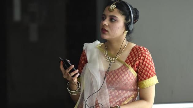 Akansha, a student seeking admission in Delhi University listens to music as she waits her turn during the preliminary rounds. Close on the heels of NCC, are the dance and debate categories that have drawn a large number of applications. (Arvind Yadav / HT Photo) Akansha, a student seeking admission in Delhi University listens to music as she waits her turn during the preliminary rounds. Close on the heels of NCC, are the dance and debate categories that have drawn a large number of applications. (Arvind Yadav / HT Photo)
