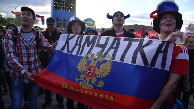 Russian fans celebrate after the hosts defeated Saudi Arabia in the opening match of the FIFA World Cup 201(AFP)