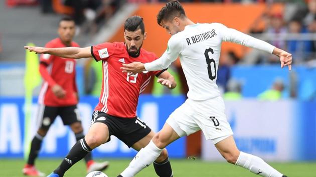 Uruguay's midfielder Rodrigo Bentancur (R) tangles with Egypt's midfielder Abdallah Said (L). (AFP)