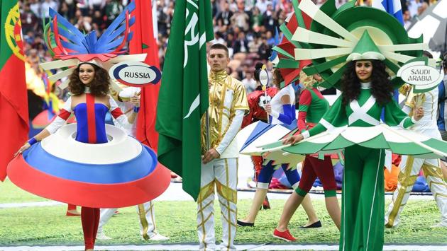 Performers from Russia and Saudi Arabia perform during the opening ceremony before the tournament's first match between their respective countries. (Patrik Stollarz / AFP)
