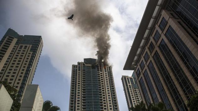 Smoke billows from a fire which broke out on the 33rd floor of Beaumonde Towers, a residential complex in Prabhadevi, Mumbai on June 13, 2018. (Pratik Chorge / HT Photo)