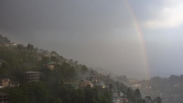A rainbow forms after the first rains of the monsoon season in Dharamshala, Himachal Pradesh on June 12, 2018. (Ashwini Bhatia / AP)