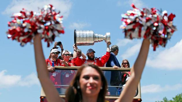 Washington Capitals left wing Alex Ovechkin (C) hoists the Stanley Cup during the Stanley Cup championship parade and celebration in Washington, D.C. (Alex Brandon / Pool Photo via USA TODAY / REUTERS) Washington Capitals left wing Alex Ovechkin (C) hoists the Stanley Cup during the Stanley Cup championship parade and celebration in Washington, D.C. (Alex Brandon / Pool Photo via USA TODAY / REUTERS)