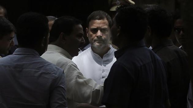 Congress President Rahul Gandhi (C) listens to party members as he arrives to appear before a court in connection with a defamation case against him, filed by an activist of Rashtriya Swayamsewak Sangh in Bhiwandi, Maharashtra on June 12, 2018. (Rafiq Maqbool / AP)