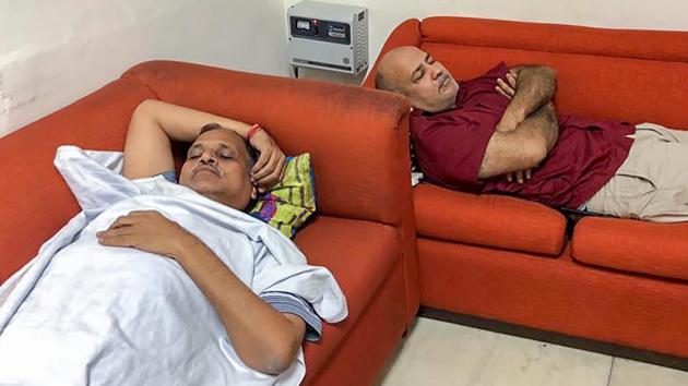 Delhi deputy CM Manish Sisodia and health minister Satyendra Kumar Jain during their ongoing sit-in protest at Lieutenant Governor Anil Baijal’s office, in New Delhi on Thursday. The ministers along with cabinet colleague Gopal Rai and chief minister Arvind Kejriwal have been at Baijal’s office for four days now. (PTI/AAP/Twitter) Delhi deputy CM Manish Sisodia and health minister Satyendra Kumar Jain during their ongoing sit-in protest at Lieutenant Governor Anil Baijal’s office, in New Delhi on Thursday. The ministers along with cabinet colleague Gopal Rai and chief minister Arvind Kejriwal have been at Baijal’s office for four days now. (PTI/AAP/Twitter)