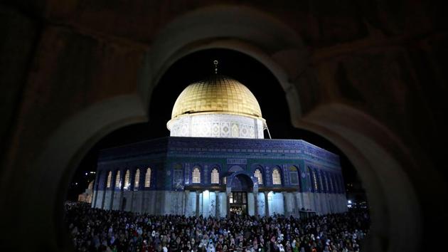Palestinian Muslims pray outside the Dome of the Rock in the Al-Aqsa mosques compound in Jerusalem's Old City on the occasion of Laylat al-Qadr, which falls on the 27th day of the fasting month of Ramzan. (Ahmad Gharabli / AFP) Palestinian Muslims pray outside the Dome of the Rock in the Al-Aqsa mosques compound in Jerusalem's Old City on the occasion of Laylat al-Qadr, which falls on the 27th day of the fasting month of Ramzan. (Ahmad Gharabli / AFP)