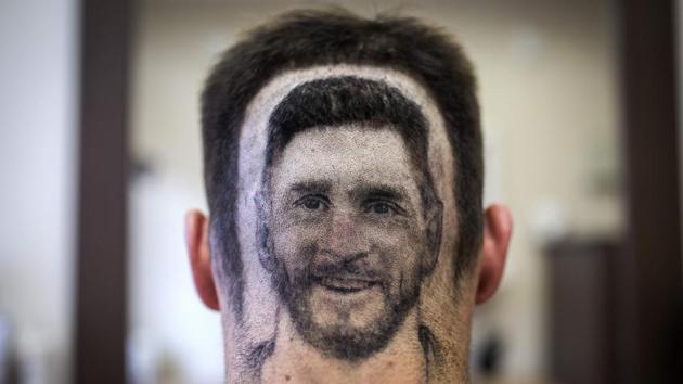 A football fan sports a hair tattoo showing the portrait of Argentinian football player Lionel Messi at a hair salon in Novi Sad, Serbia. (Vladimir Zivojinovic / AFP) A football fan sports a hair tattoo showing the portrait of Argentinian football player Lionel Messi at a hair salon in Novi Sad, Serbia. (Vladimir Zivojinovic / AFP)