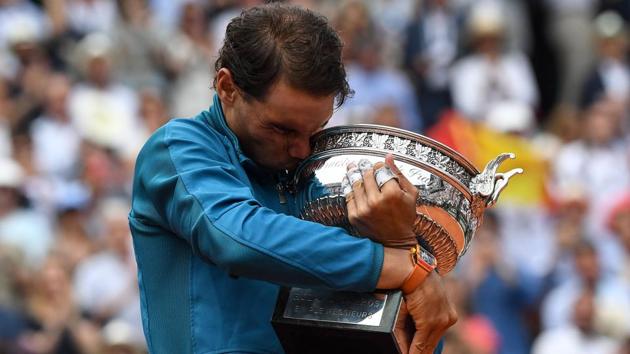 Spain's Rafael Nadal kisses the Mousquetaires Cup (The Musketeers) after his victory in the men's singles final match against Austria's Dominic Thiem, on day fifteen of The Roland Garros 2018 French Open tennis tournament in Paris, France. (Christophe Archambault / AFP) Spain's Rafael Nadal kisses the Mousquetaires Cup (The Musketeers) after his victory in the men's singles final match against Austria's Dominic Thiem, on day fifteen of The Roland Garros 2018 French Open tennis tournament in Paris, France. (Christophe Archambault / AFP)