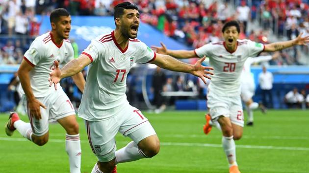 Iran's Mehdi Taremi, Majid Hosseini and Sardar Azmoun celebrate their first goal against Morocco in the FIFA World Cup 2018.(REUTERS)