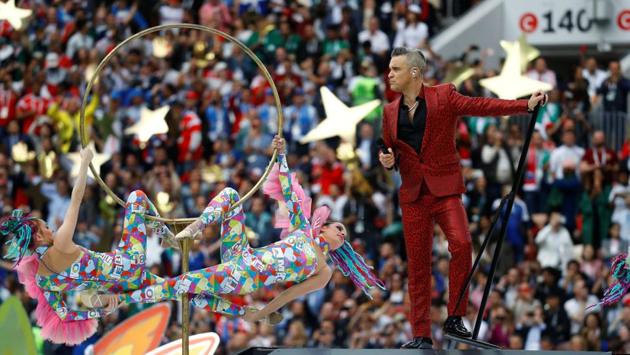 British pop star Robbie Williams performs during the opening ceremony of the 2018 FIFA World Cup at the Luzhniki Stadium in Moscow on June 14, 2018. The month long football extravaganza kicked off yesterday with an opening ceremony followed by a match between host Russia and Saudi Arabia. Russia laid down a smashing 5-0 victory. (Kai Pfaffenbach / REUTERS)