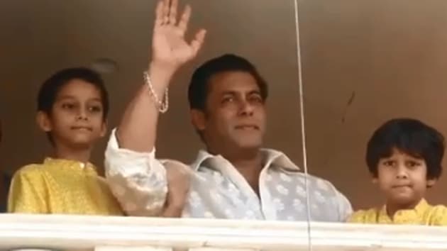 Salman Khan waves to his fans from his apartment.