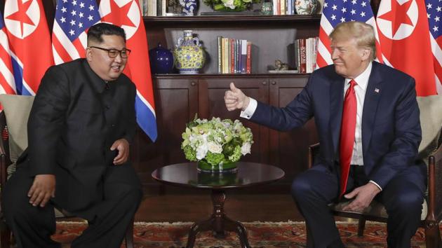 US President Donald Trump (right) gives North Korean leader Kim Jong Un a thumbs up during their meeting at a resort on Sentosa Island in Singapore on June 12.(AP file photo)