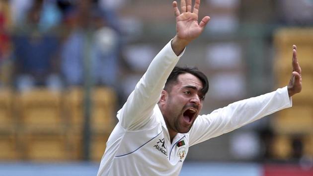 Afghanistan's Rashid Khan appeals successfully for the wicket of India's Ishant Sharma during the second day of one-off cricket test match in Bangalore.(AP)