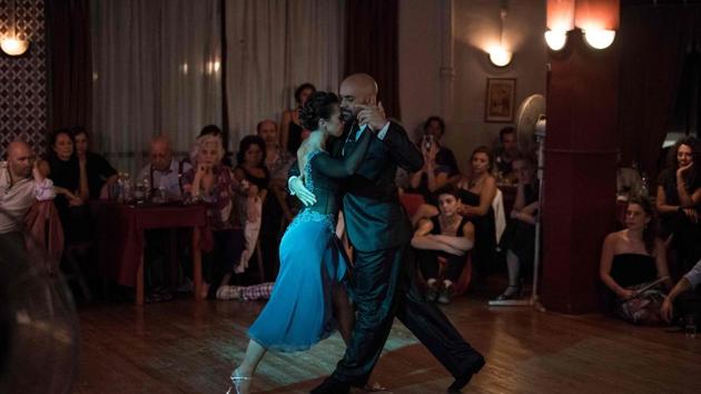 Stage tango world champion Maria Noel Sciuto (L), dances with Rodrigo Fleitas during an exhibition at Chamuyo milonga in Montevideo.(AFP)