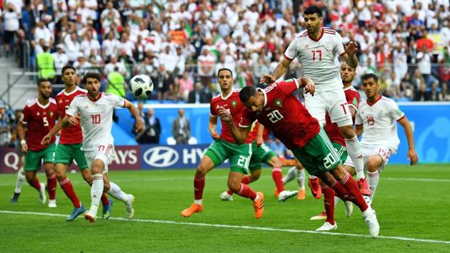 Morocco's Aziz Bouhaddouz scores an own goal against Iran. (REUTERS)