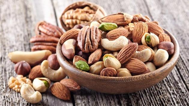 Eating several servings of nuts, such as almonds, every week may help lower the risk of developing heart rhythm irregularity.(Shutterstock)