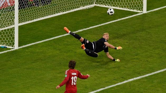 Denmark's goalkeeper Kasper Schmeichel makes a save as Peru fail to get back on equal terms. (AFP)