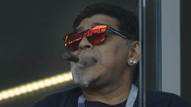 Diego Maradona smokes a cigar during the FIFA World Cup 2018 Group D match between Argentina and Iceland at the Spartak Stadium on Saturday.(AFP)