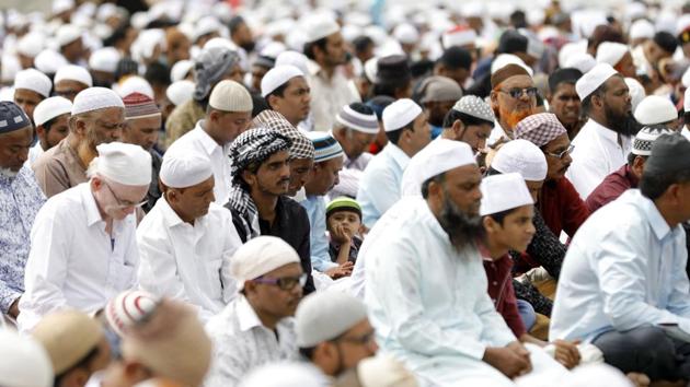 EMBRACING FESTIVITIES: A young boy looks on as men offer namaz on the occasion of Eidulfitr at Golibar Maidan on Saturday. The day marks the end of Ramadan, the Islamic holy month of fasting on Saturday. (Rahul Raut/HT PHOTO) EMBRACING FESTIVITIES: A young boy looks on as men offer namaz on the occasion of Eidulfitr at Golibar Maidan on Saturday. The day marks the end of Ramadan, the Islamic holy month of fasting on Saturday. (Rahul Raut/HT PHOTO)