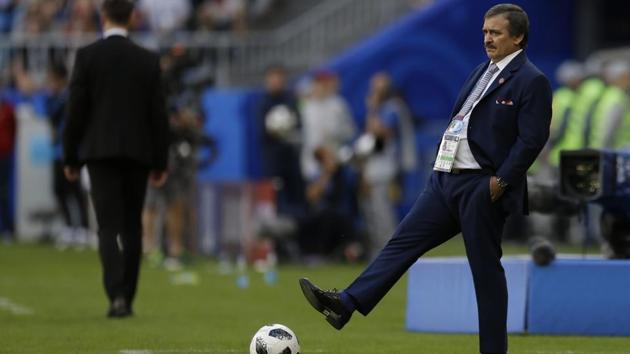 Costa Rica head coach Oscar Ramirez kicks a ball during the group E match against Serbia. (AP)