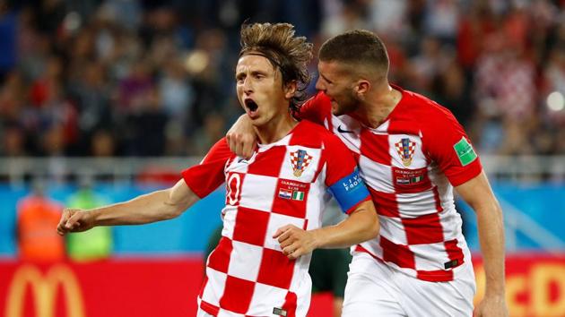 Croatia's Luka Modric celebrates with Ante Rebic as he converted a penalty to give Croatia a 2-0 win over Nigeria. (REUTERS)