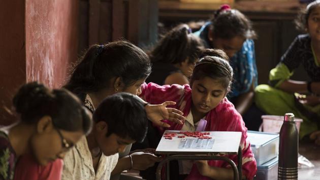 Children engaged in educational activities at Manav Sadhana. The memorial trust has taken up projects such as a non-violence programme in schools, to teach children the importance of finding solutions to problems by non-violent methods. Another important work of the trust has been to create the Gandhi Heritage Portal, which in the last six years, has digitised his writings, journals and photos. (Aalok Soni / HT Photo) 