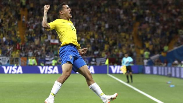 Brazil's Philippe Coutinho celebrates after scoring his side's opening goal in the 20th minute. (AP)