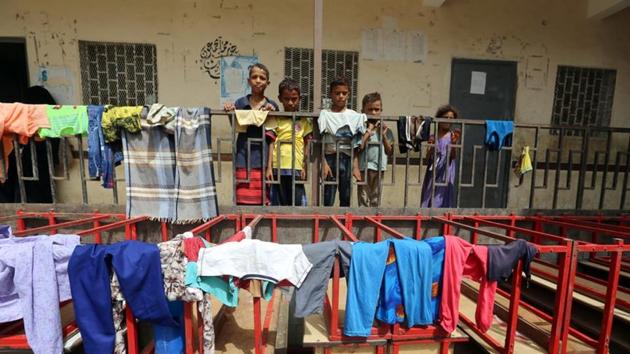 Children stand behind a fence at a school to which they have been evacuated from a village near Hodeidah airport amid fighting between government forces and Houthi fighters in Hodeidah, Yemen. (Reuters Photo) Children stand behind a fence at a school to which they have been evacuated from a village near Hodeidah airport amid fighting between government forces and Houthi fighters in Hodeidah, Yemen. (Reuters Photo)