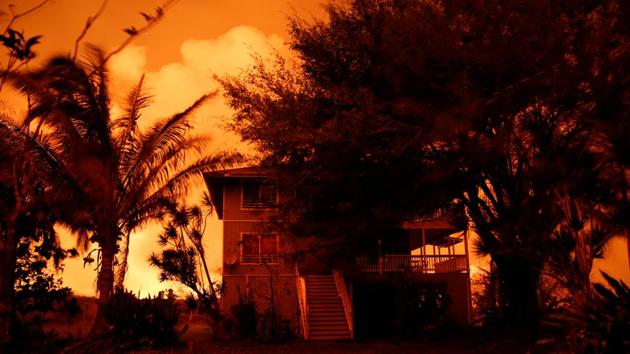 Lava illuminates an evacuated house on the outskirts of Pahoa. And atop the hill, the house is safe from the lava flows and its attendant fires. “We’re not stupid. We thought this out,” Altman said. (Terray Sylvester / REUTERS) Lava illuminates an evacuated house on the outskirts of Pahoa. And atop the hill, the house is safe from the lava flows and its attendant fires. “We’re not stupid. We thought this out,” Altman said. (Terray Sylvester / REUTERS)