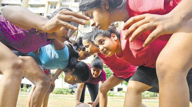 Girls scrummage during a rugby practice session at Hills and Dales society on Saturday. Shreya Pardeshi trains the upcoming stars in Neha’s absence. (Shankar Narayan/HT PHOTO) Girls scrummage during a rugby practice session at Hills and Dales society on Saturday. Shreya Pardeshi trains the upcoming stars in Neha’s absence. (Shankar Narayan/HT PHOTO)
