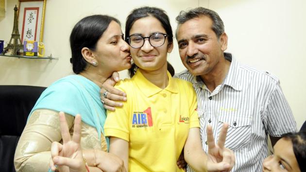Eliza along with her Parents in a jubilant mood in Patiala after getting AIR 1st rank in AIIMS MBBS entrance test on Monday.(Bharat Bhushan/ Hindustan Times)