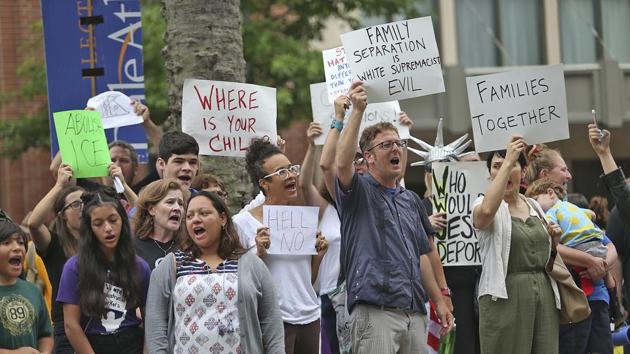 People protest the policy of separating families at the border outside the Ernest N Morial Convention Center in New Orleans where Attorney General Jeff Sessions was addressing the National Sheriffs' Association on June 18, 2018.(AP)